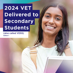 VDSS Cover 2024. Woman wearing backpack, smiling, and holding books.