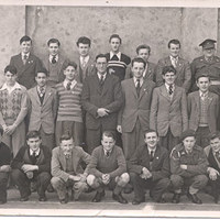 1950's Black and White photo of group of male students with lecturers