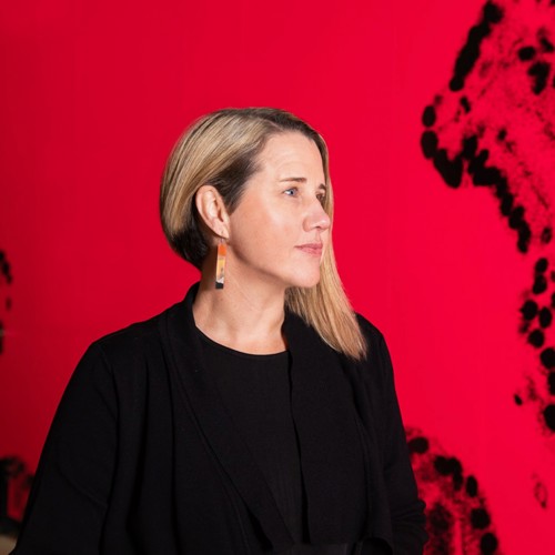 Image of Beck Storer with a red background