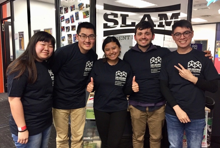 International students in Melbourne Polytechnic t-shirts standing with arms around each other's shoulders