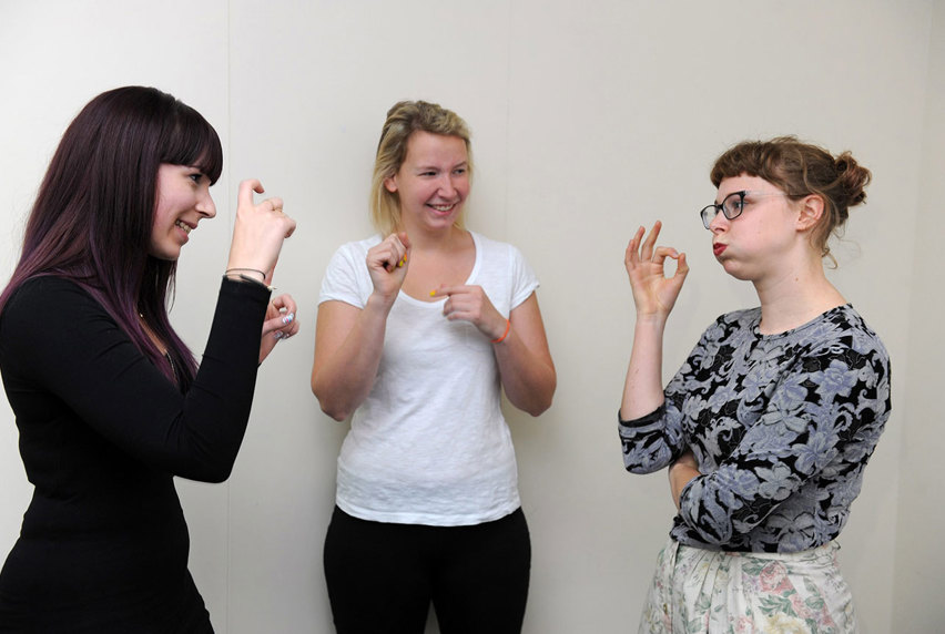 three women signing using Auslan