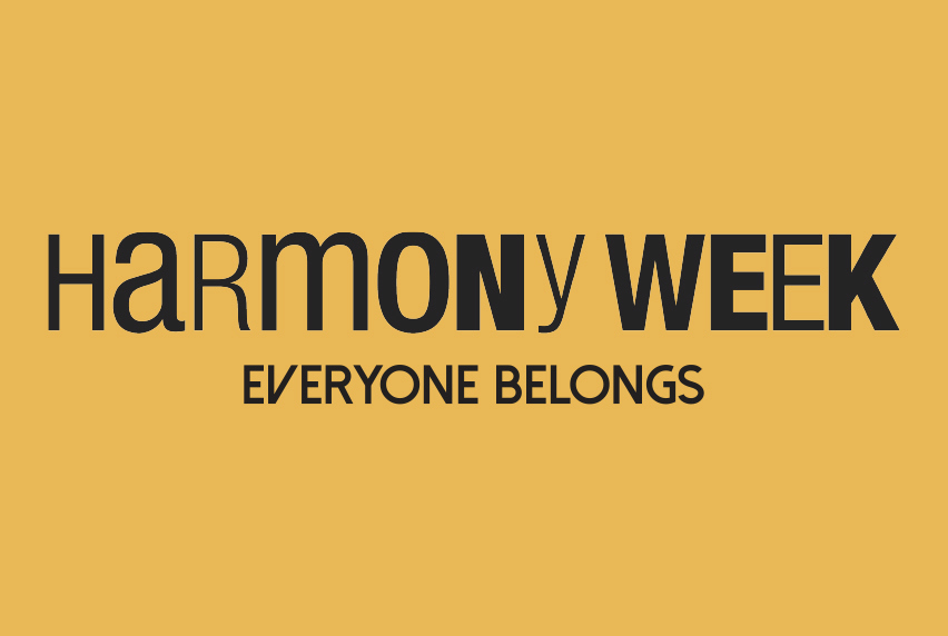 Yellow background with black text that reads Harmony Week everyone belongs 