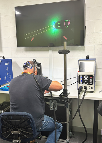 Welding teacher on virtual welder