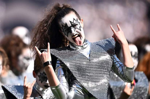 A KISS performer 'rocking on' the AFL Grand Final KISS Spectacular show