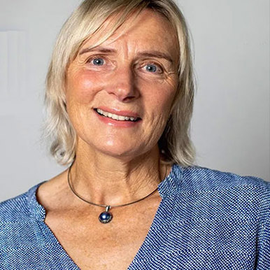Image of a woman with blonde hair and blue shirt