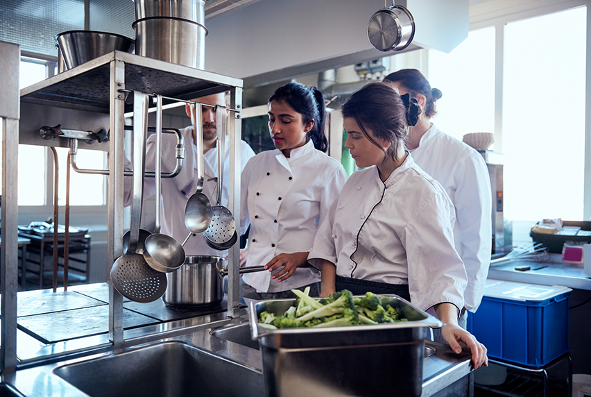 Commercial Cookery students learning in a commercial kitchen