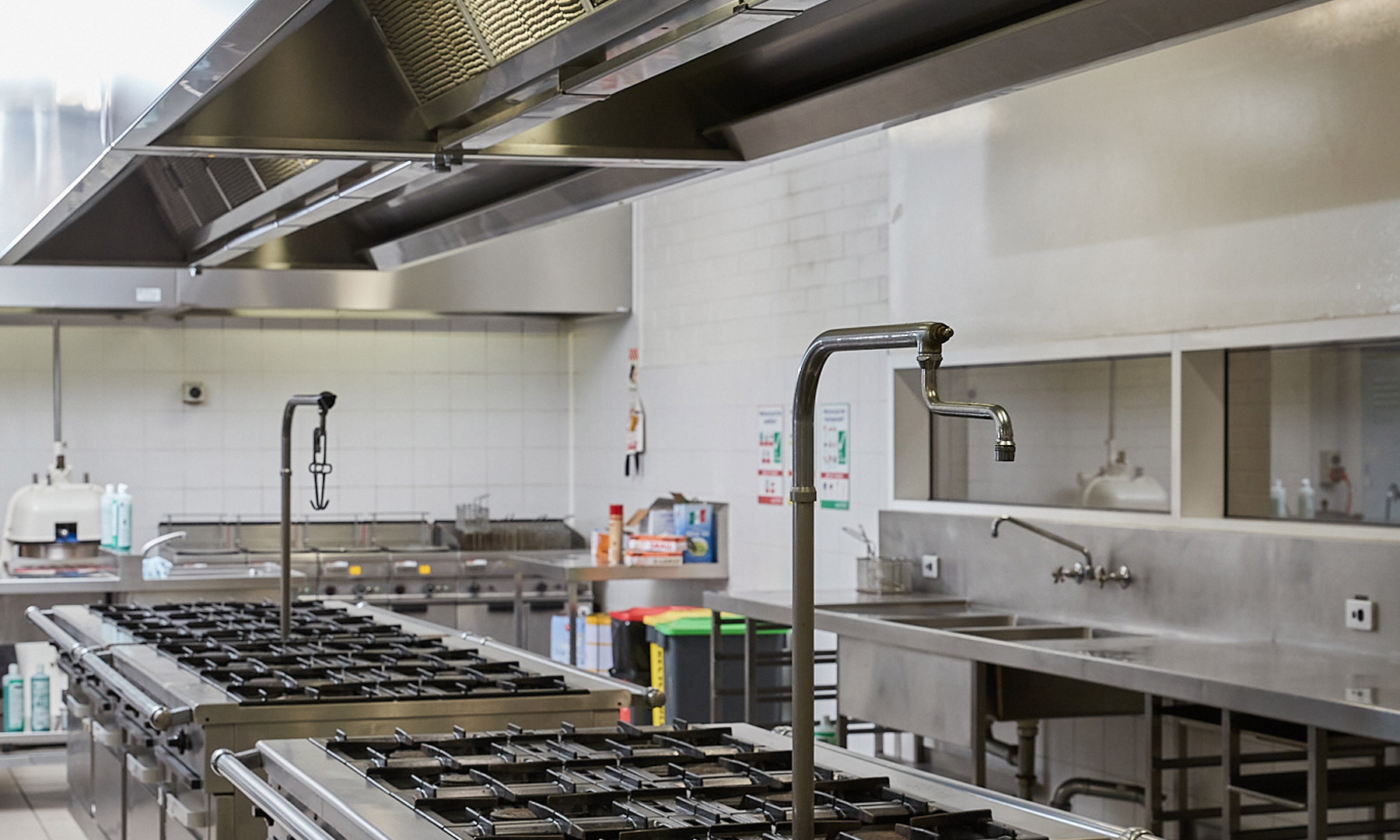 Kitchen facility at Melbourne Polytechnic Preston Campus, filled with an array of gas stoves.
